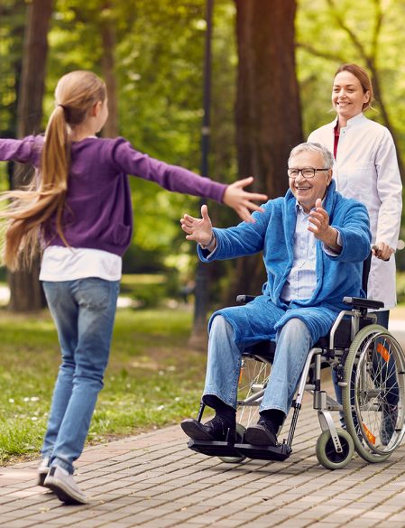 cheerful grandchildren visiting senior disabled father in park